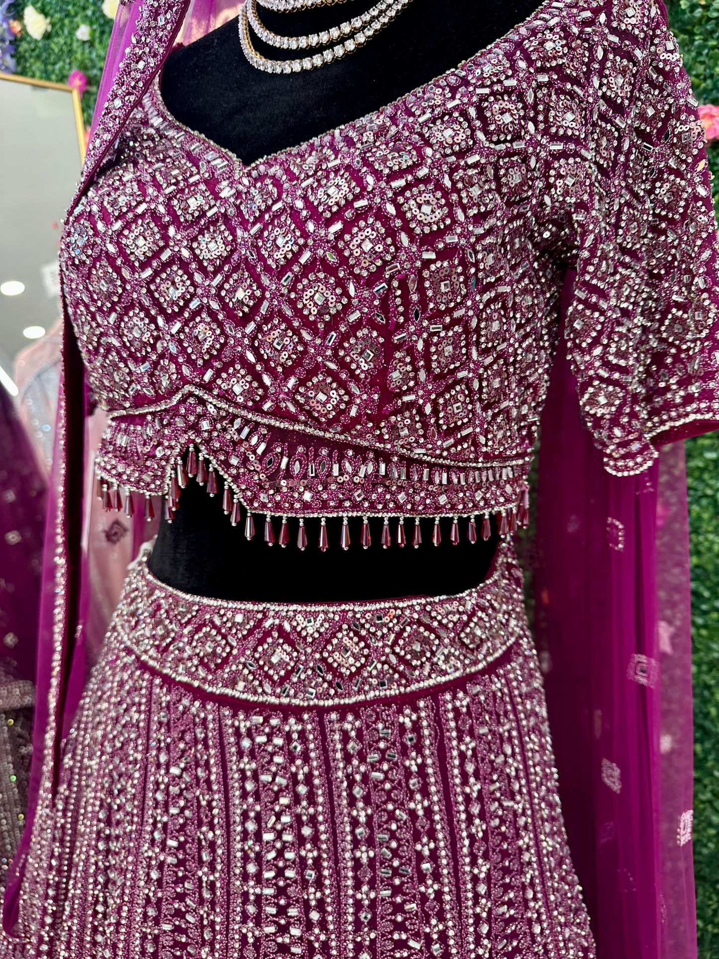 Deep plum heavy stone work bridal lehenga