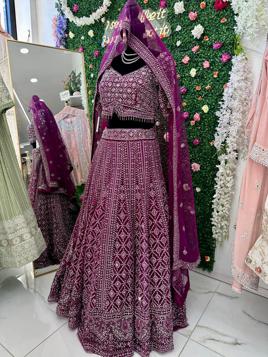 Deep plum heavy stone work bridal lehenga