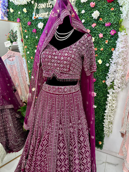 Deep plum heavy stone work bridal lehenga