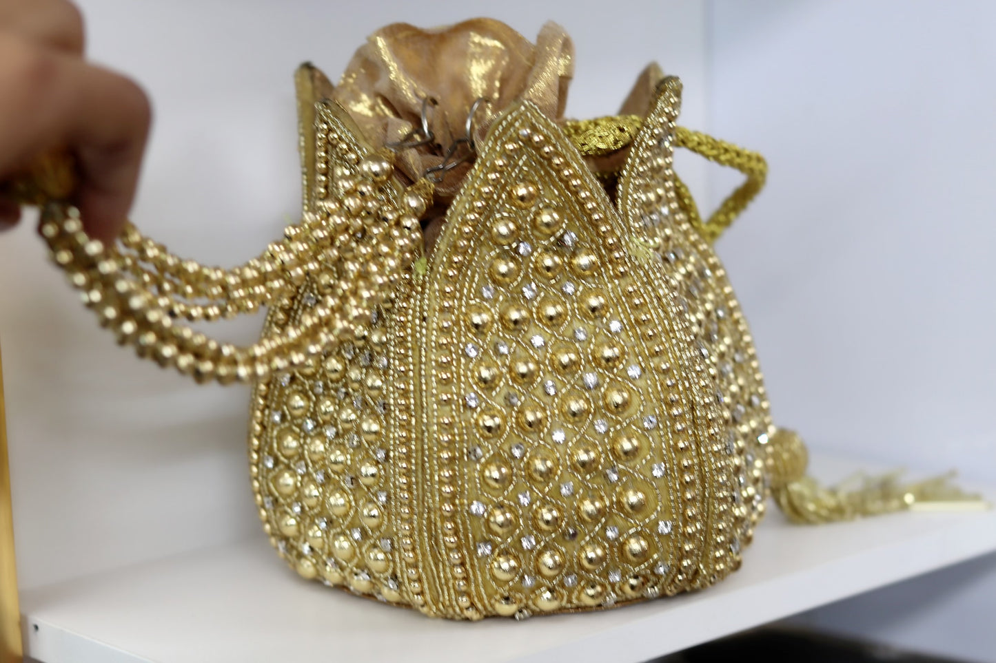 Gold over the top pouch purse