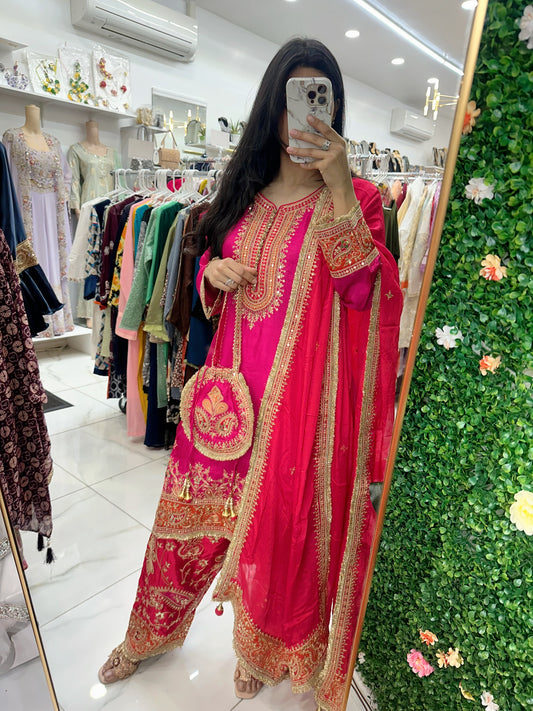 Hot pink fancy salwar kameez with potli bag