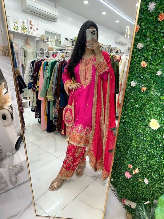 Hot pink fancy salwar kameez with potli bag